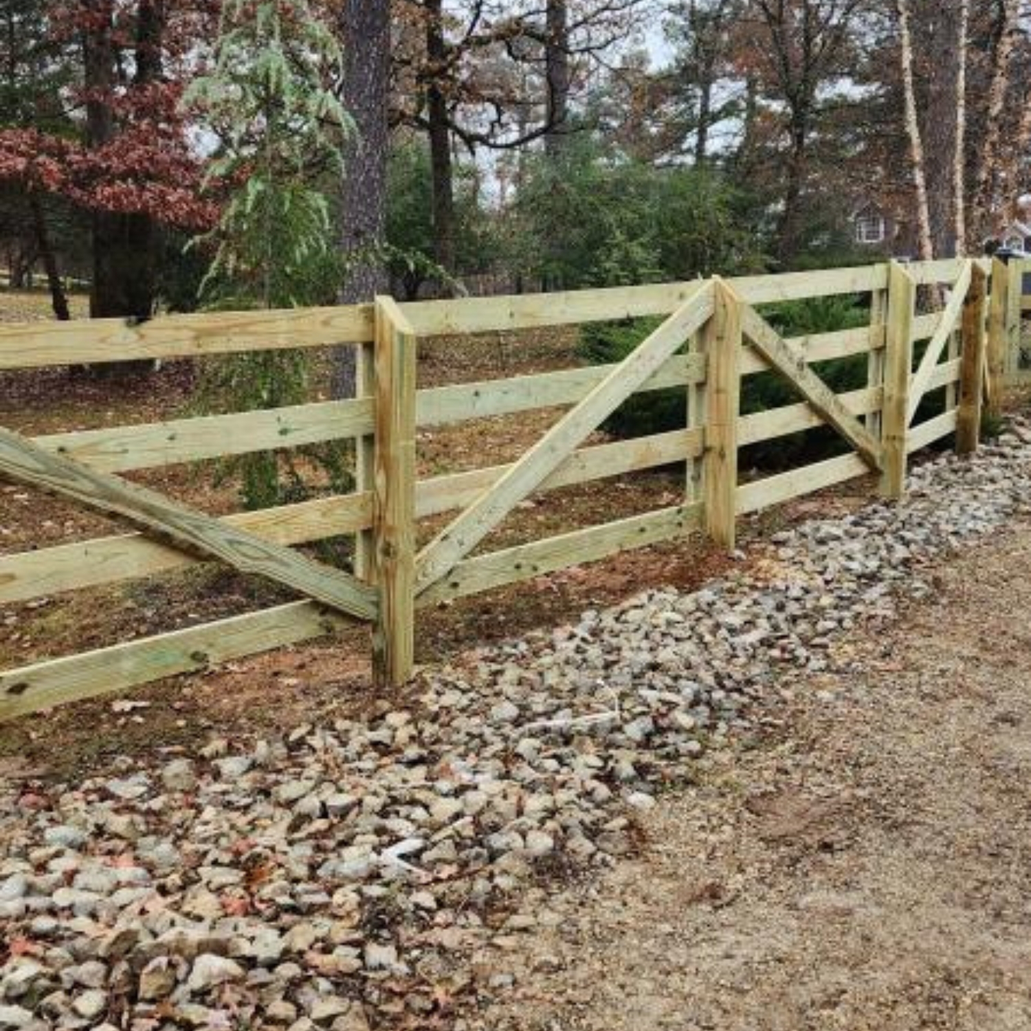 split rail wood fence up driveway